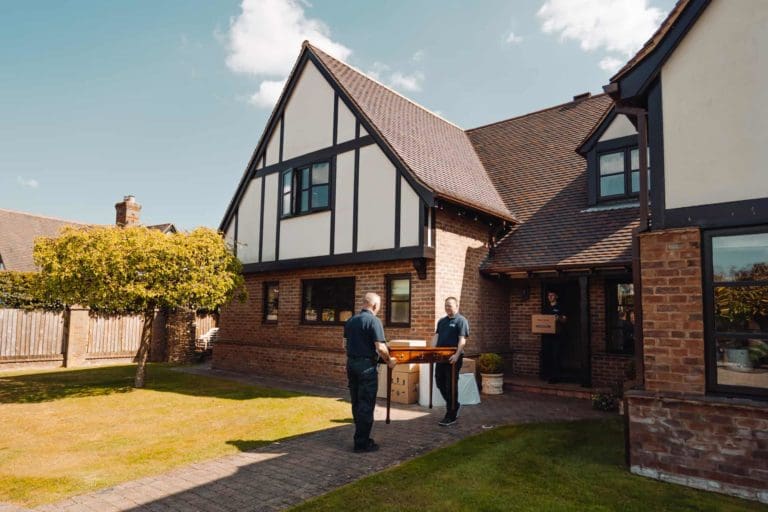 Roy Trevor team loading out furniture